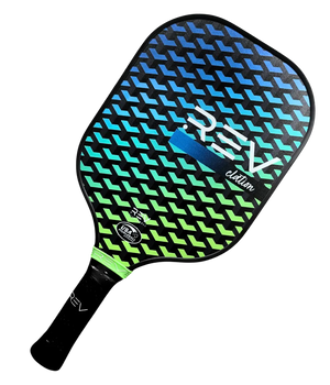 Angled view of the REV ELATION fiberglass pickleball paddle showing the fiberglass face and edge guard