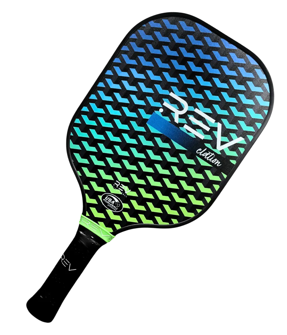 Angled view of the REV ELATION fiberglass pickleball paddle showing the fiberglass face and edge guard
